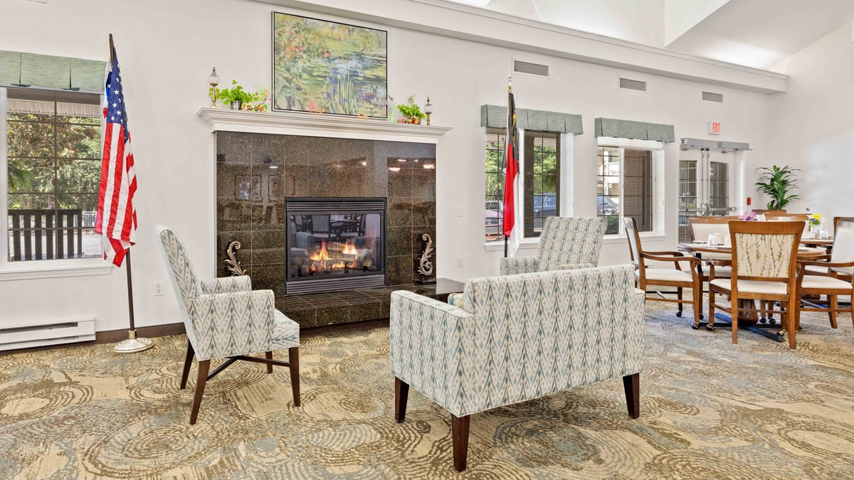 A cozy fireplace lounge at Carolina Estates